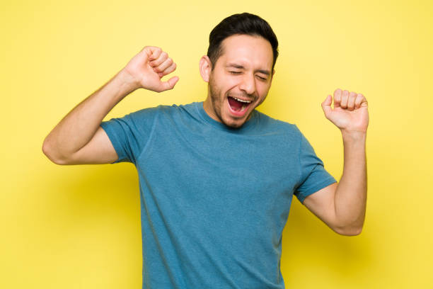 istock Exhausted latin man in his 30s stretching and yawning 1307503642