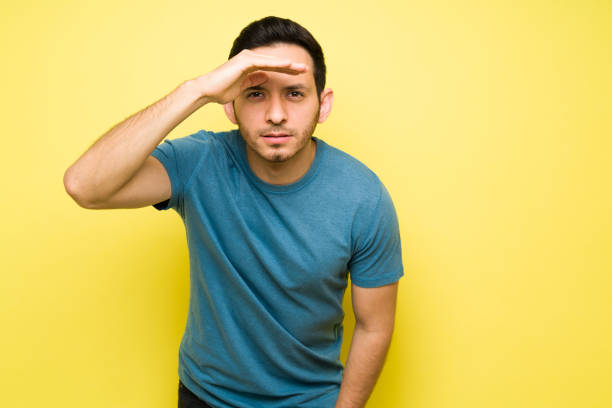 istock Short-sighted attractive man in his 30s looking ahead 1307503663
