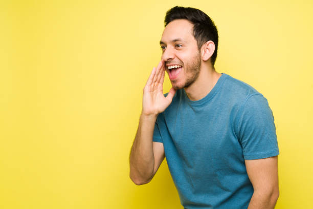 istock Attractive man yelling and calling to someone 1307503673