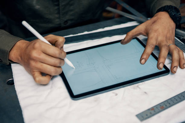 istock Mid adult male using a digital tablet in the manufacturing process 1307505287