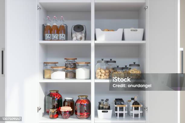 Organised Pantry Items With Variety Of Nonperishable Food Staples And Preserved Foods In Jars On Kitchen Shelf Stock Photo - Download Image Now