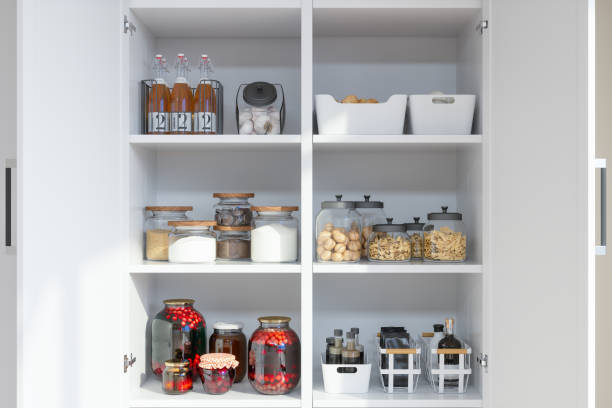 organised pantry items with variety of nonperishable food staples and preserved foods in jars on kitchen shelf. - cooking process imagens e fotografias de stock