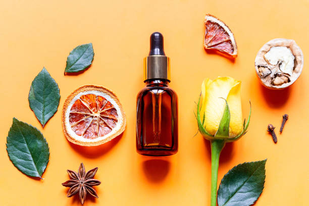 istock perfume and natural ingredients on orange background close up 1307515309