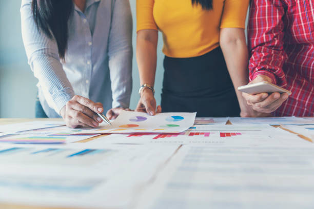 istock Business strategy team report chart, graph, infographic data analyze financial report plan. Hands team partner planning marketing finance statistics sale report with excel spreadsheet accountting 1307515541