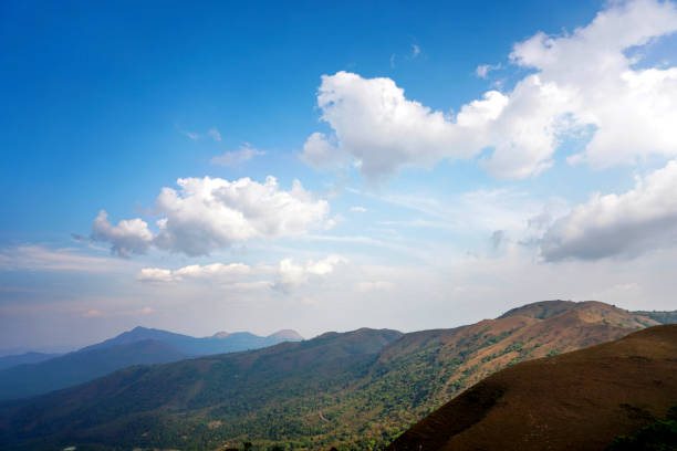 istock Green valley and mountain range with moody sky 1307517967