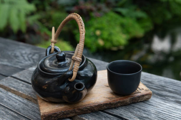 istock Black Japanese tea cup on wooden background, 1307518218