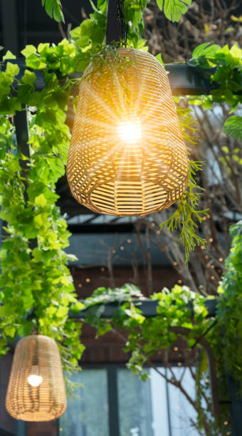 istock Rattan lamp on the textured background on the ceiling 1307518226