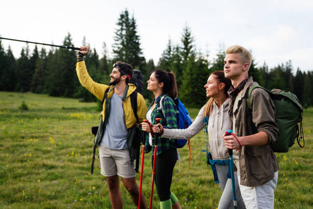 istock Friends hiking together outdoors exploring the wilderness 1307520622