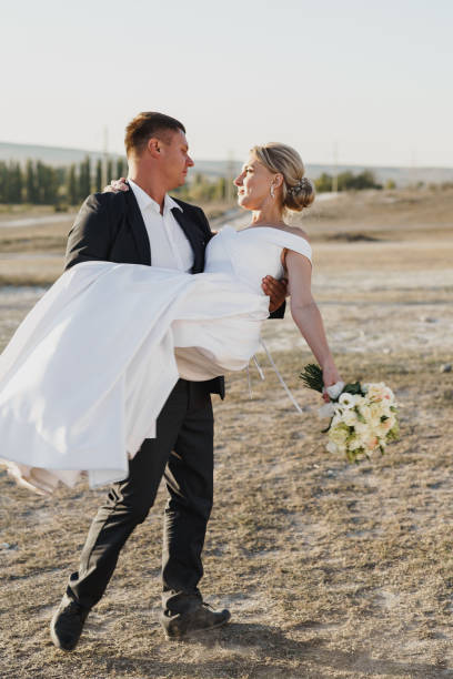 istock Happy bride and groom looking at each other with a smile 1307521729