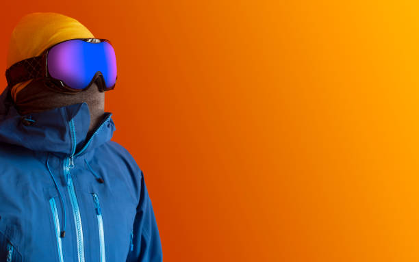 istock Skier in blue hardshell jacket and ski goggles 1307524618