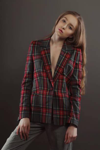 istock Beautiful blonde young model posing for model tests  in tartan jacket 1307526948