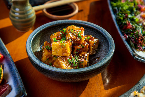 istock Fried tofu cubes served with black and white sesame in a bowl 1307527907