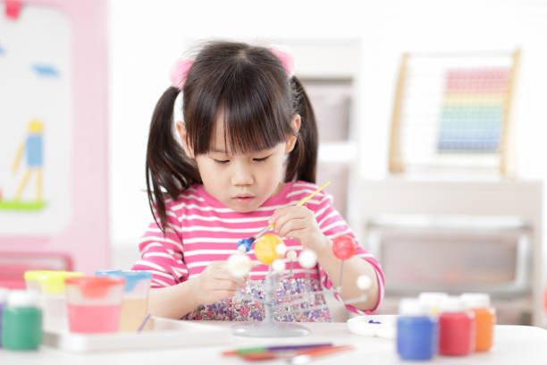 istock Young Girl Making Craft For Homeschooling 1307528971