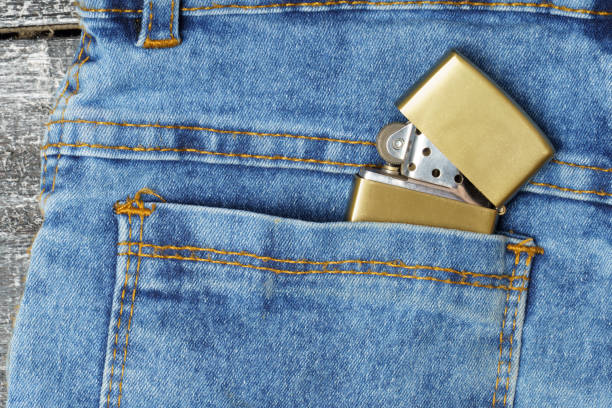 istock metal lighter in the back pocket of jeans. 1307530436