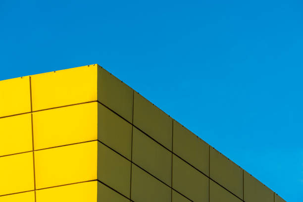 istock Low Angle View Of Yellow Building Against Clear Blue Sky 1307530679