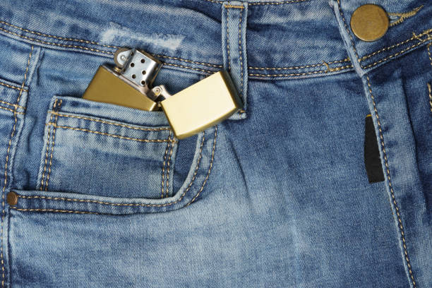 istock metal lighter in a pocket of blue jeans 1307530947