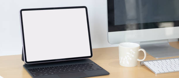 istock Laptop computer with white blank screen on desk in workspace and copy space concept 1307533792
