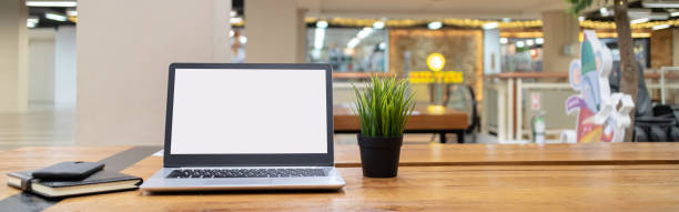 istock Laptop computer with white blank screen on desk in workspace and copy space concept 1307534427