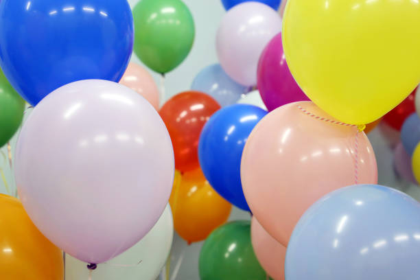 istock Helium balloons with ribbons in the office 1307534610
