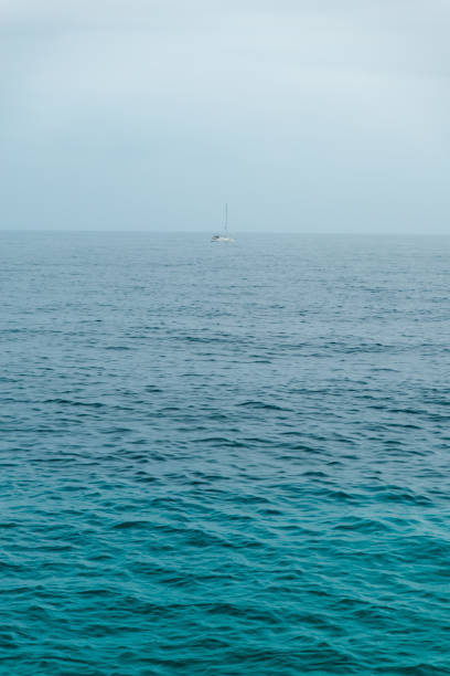 view on yacht boat in rainy overcast sea copy space