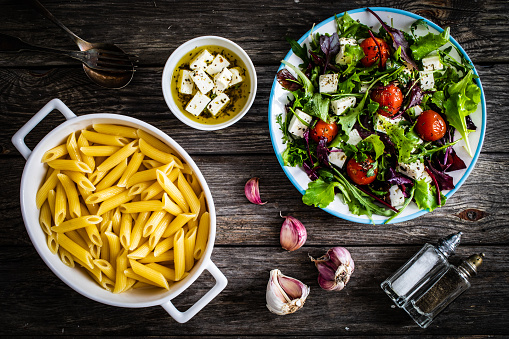 Greek salad on wooden table
