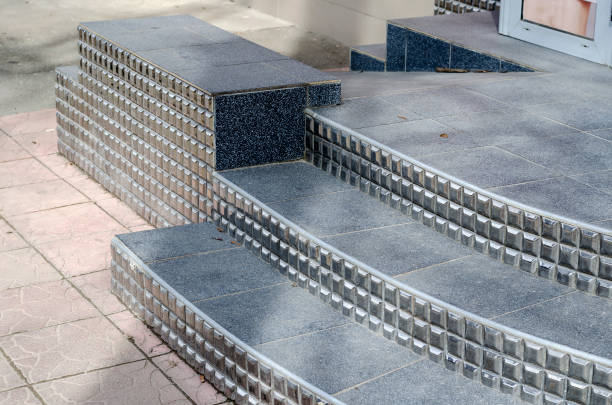 istock Fragment of black steps and ramp for the disabled. 1307539543