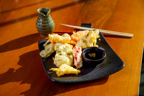 istock Vegetable tempura with soy sauce on square plate 1307540506