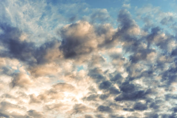 istock Cloud front with mystical, unreal light in front of a blue sky just before the threatening thunderstorm 1307542250