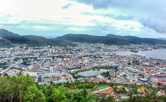 Large panorama view with downtown Bergen, harbour, fjord and surrounding mountains