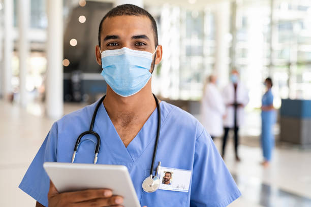 istock Middle eastern nurse wearing face mask at hospital 1307543588