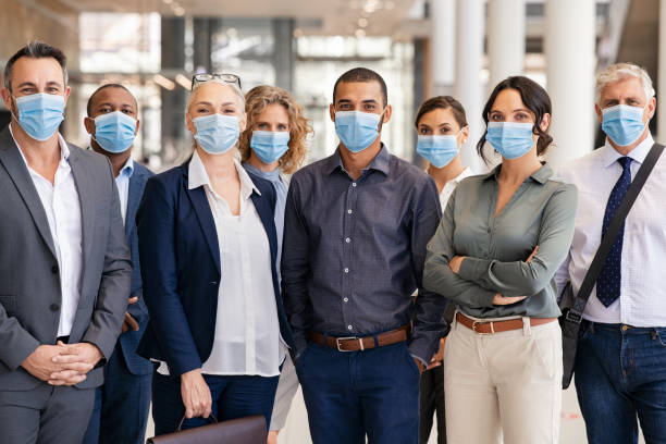 istock Portrait of multiethnic business people group wearing mask 1307543607