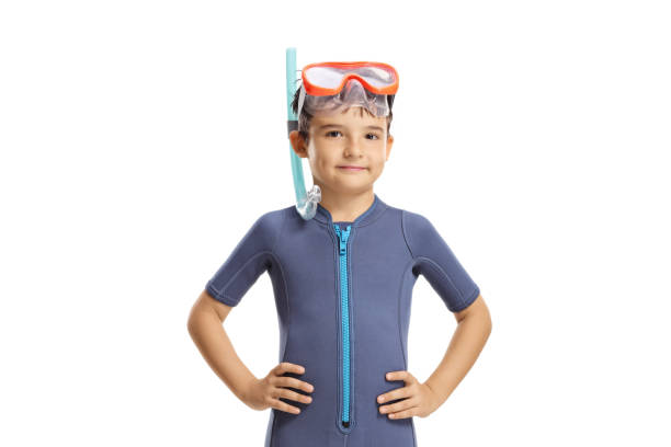 istock Child in a wetsuit and diving mask posing 1307547472