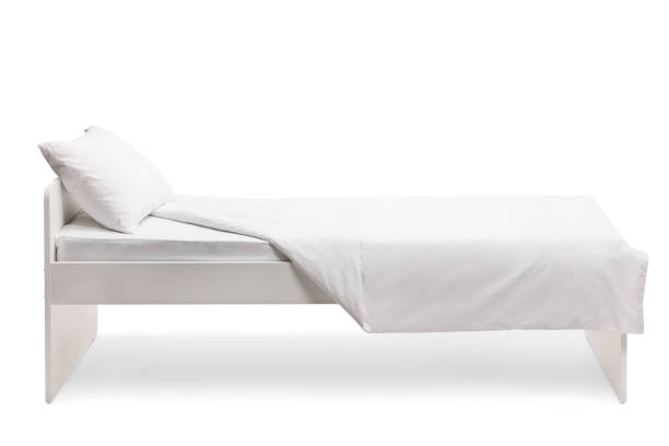 istock Studio side shot of a white single bed 1307548508