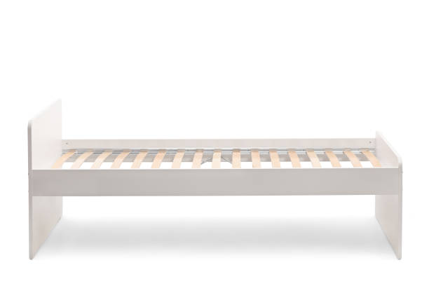 istock Studio shot of a white single bed with bed frame 1307548780