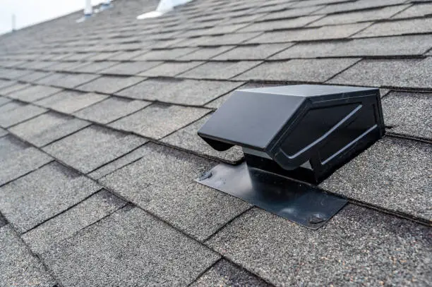 Photo of Static vent installed on a shingle roof for passive attic ventilation