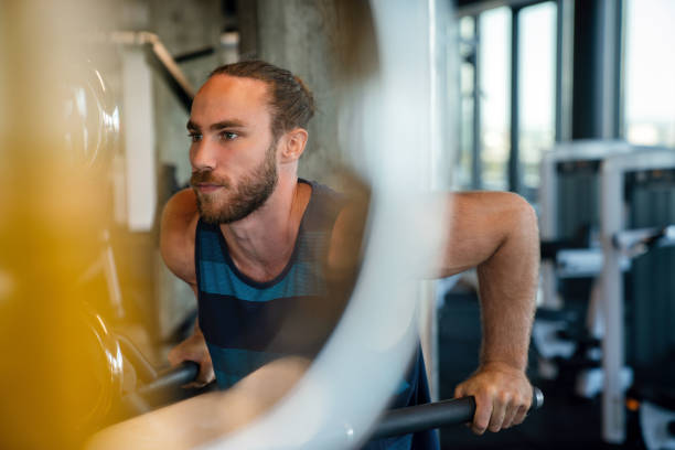 istock Handsome bodybuilder man works out and excercise in gym 1307551464
