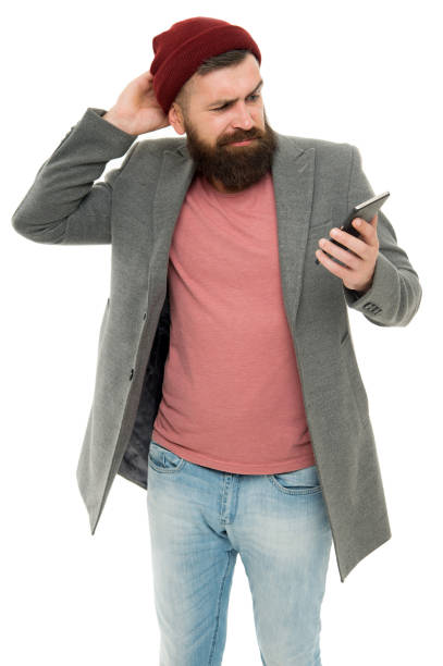 istock Mobile game is an interactive entertainment. Hipster playing mobile game via wifi or 3G. Gamer participating in multiplayer game on smartphone. Bearded man player enjoying free online game 1307552119