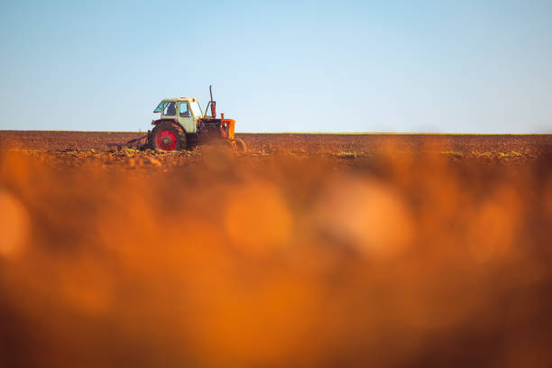 Tractor plowing the fields , agricultural landscape