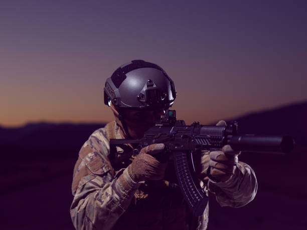 istock soldier with full combat gear in night mission 1307553645
