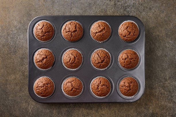istock Homemade chocolate cupcakes in baking form 1307555525