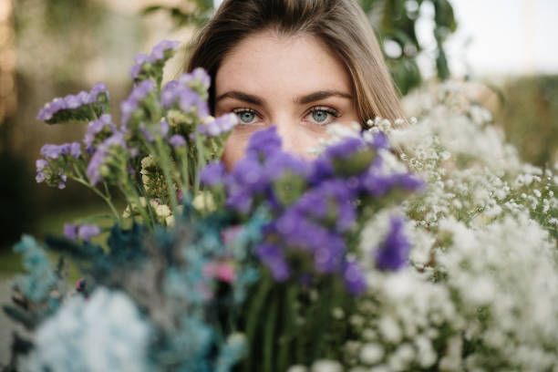 istock Young woman holding a flower bouquet 1307555542