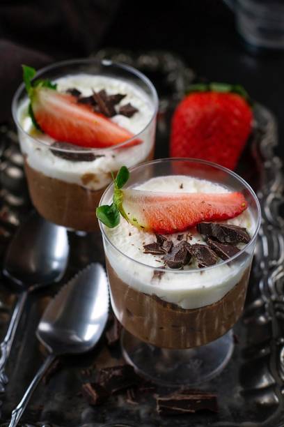 istock Sweet chocolate mousse dressed with whipped cream and fresh strawberry 1307558465