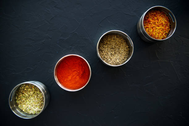 istock large set of Indian spices and herbs. On black board. 1307559190