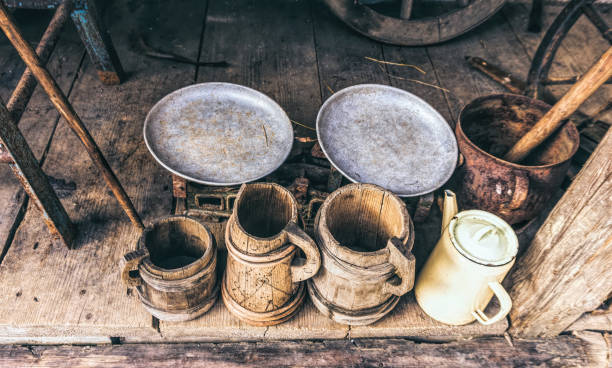 istock Old wooden beer mugs and jugs. Rustic antique tableware 1307559605