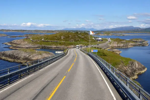 Driving on the world famous Storseisund Bridge on the so called Atlantic Road in Norway - Famous sightseeing spot and one of the most beautiful, spectacular and unique road trips ride in Europe