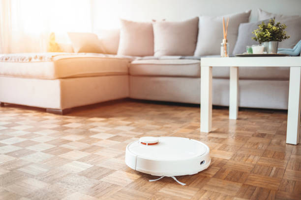 istock Robotic vacuum cleaner on the floor. 1307560580
