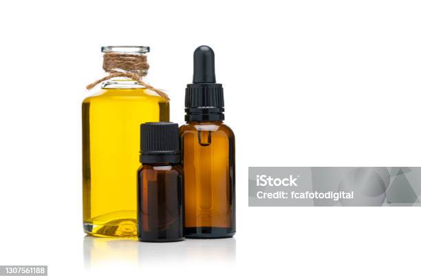 Aromarherapy And Health Care Essential Oil And Massage Oil Isolated Bottles On White Background Stock Photo - Download Image Now