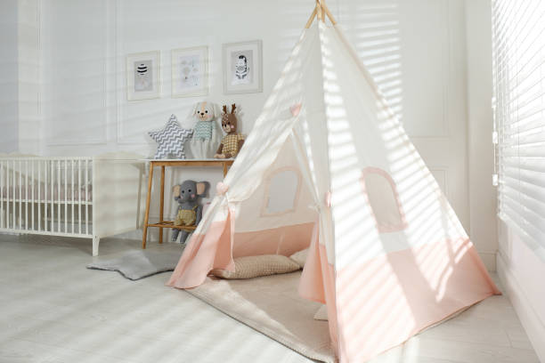 istock Comfortable crib and play tent in baby room. Interior design 1307562537