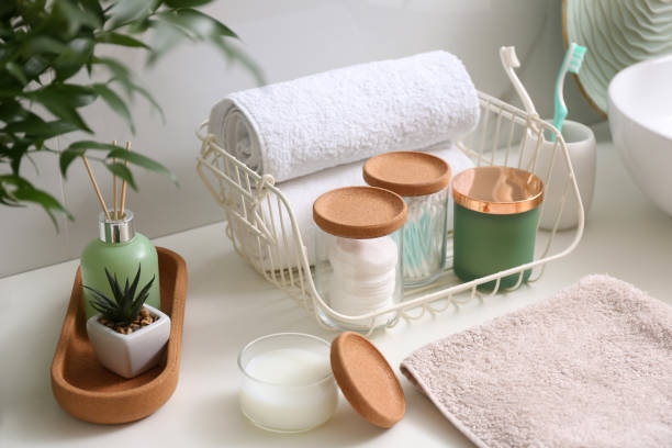 istock Personal hygiene products on table near white wall in bathroom 1307562819