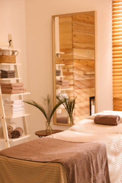 istock Stylish massage room interior in spa salon 1307562833